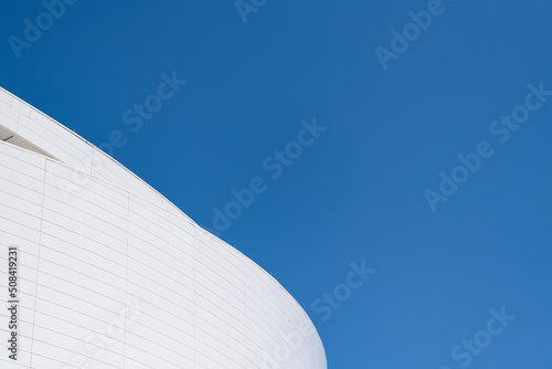 Architectural detail of modern building facade exterior architecture on blue sky, copy space