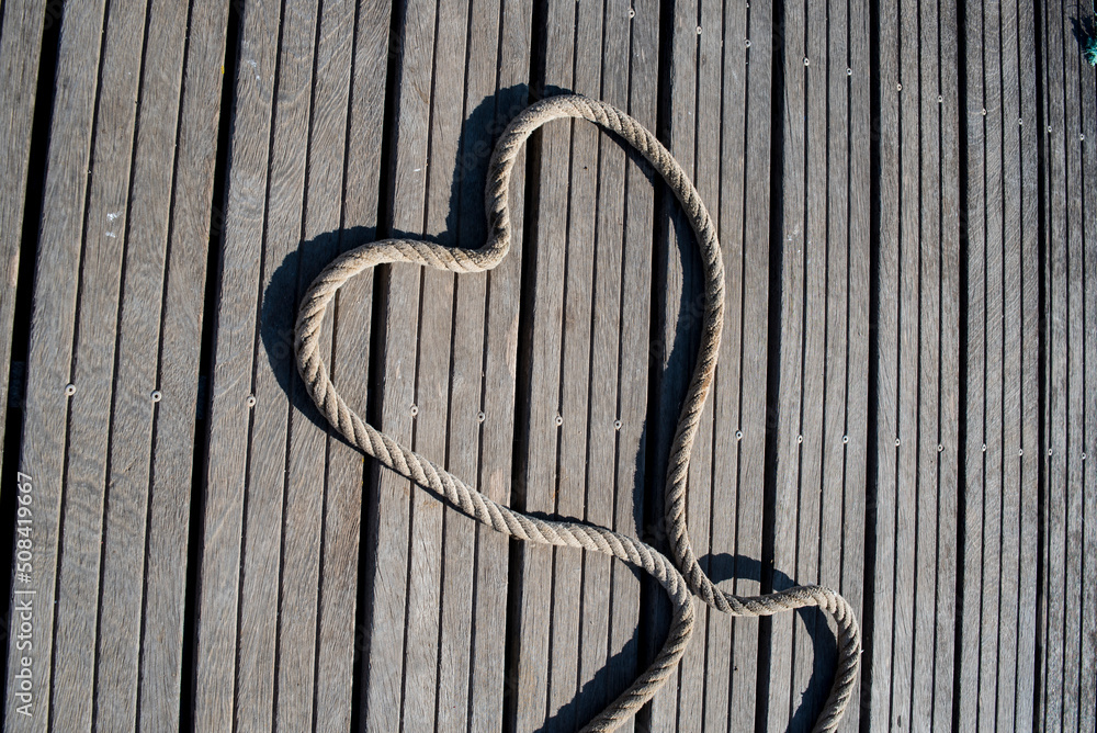 Heart-shaped rope on the floor of the marina