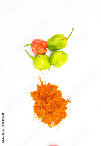 Obraz na płótnie Spicy naga chili with chili powder isolate on white background, top view w salonie