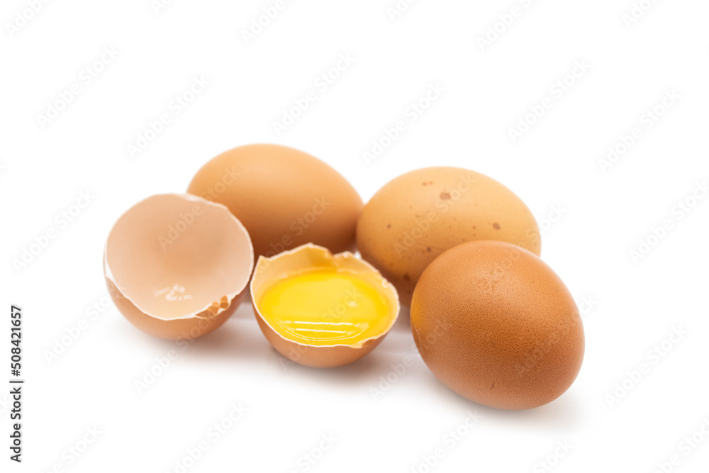 whole eggs and one broken isolated on a white background whole eggs and one broken isolated on a white background