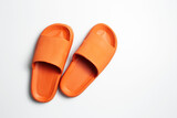 Top view of colourful slippers of orange color, isolated on white background.