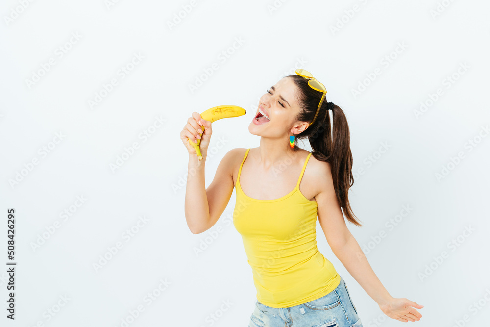 Cheerful young woman wearing summer outfit singing Cheerful young woman wearing summer outfit singing