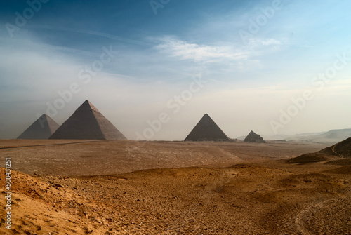 The great Egyptian pyramids. The deserted landscape with pyramids on Giza Plateau.