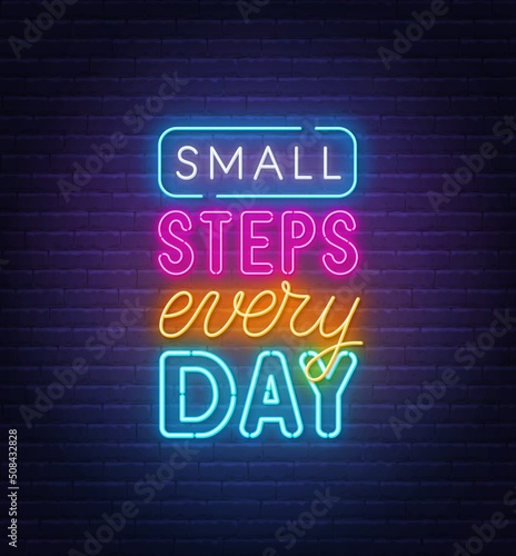 Small steps every day neon quote on a brick wall.