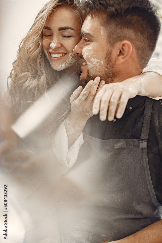 Fototapeta premium Young couple at artwork in pottery