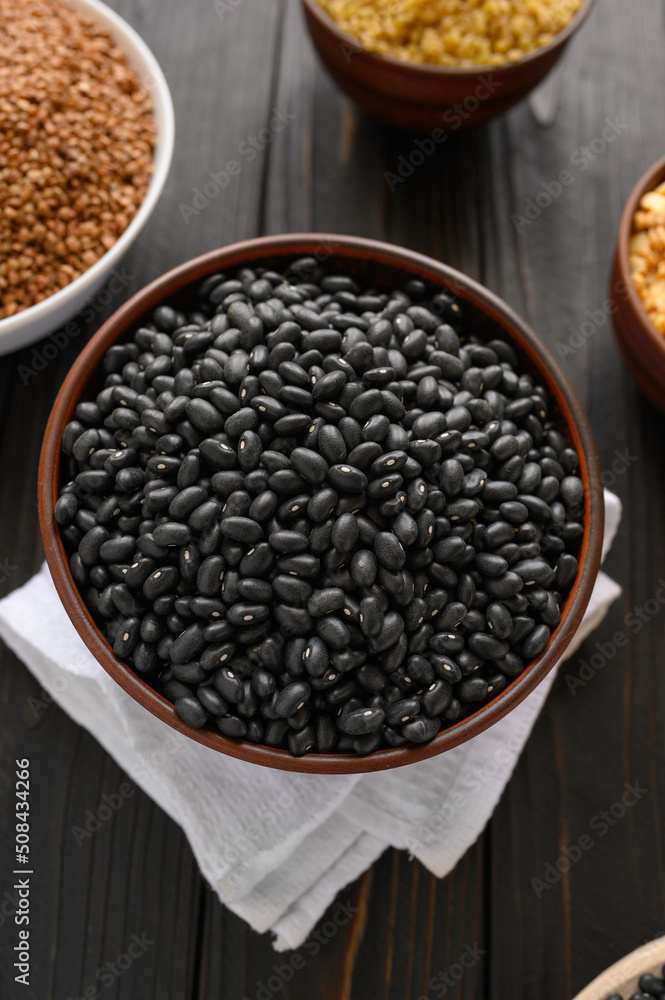Fresh organic natural beans on wooden rustic black background Fresh organic natural beans on wooden rustic black background