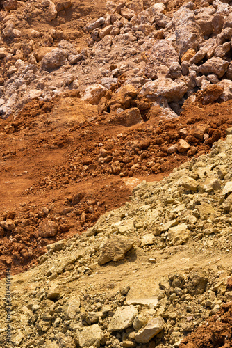 Accumulation of very dry earth with earthy colors, predominantly ocher and pink.