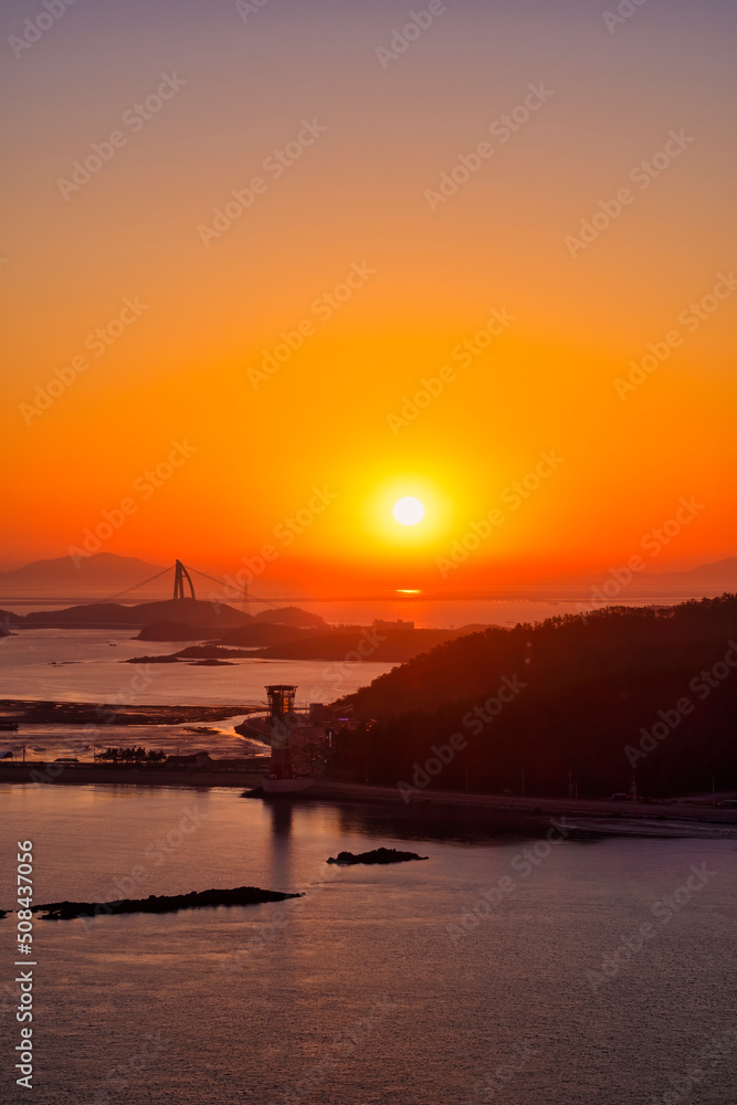 Scenic view of sea and islands during sunrise Scenic view of sea and islands during sunrise