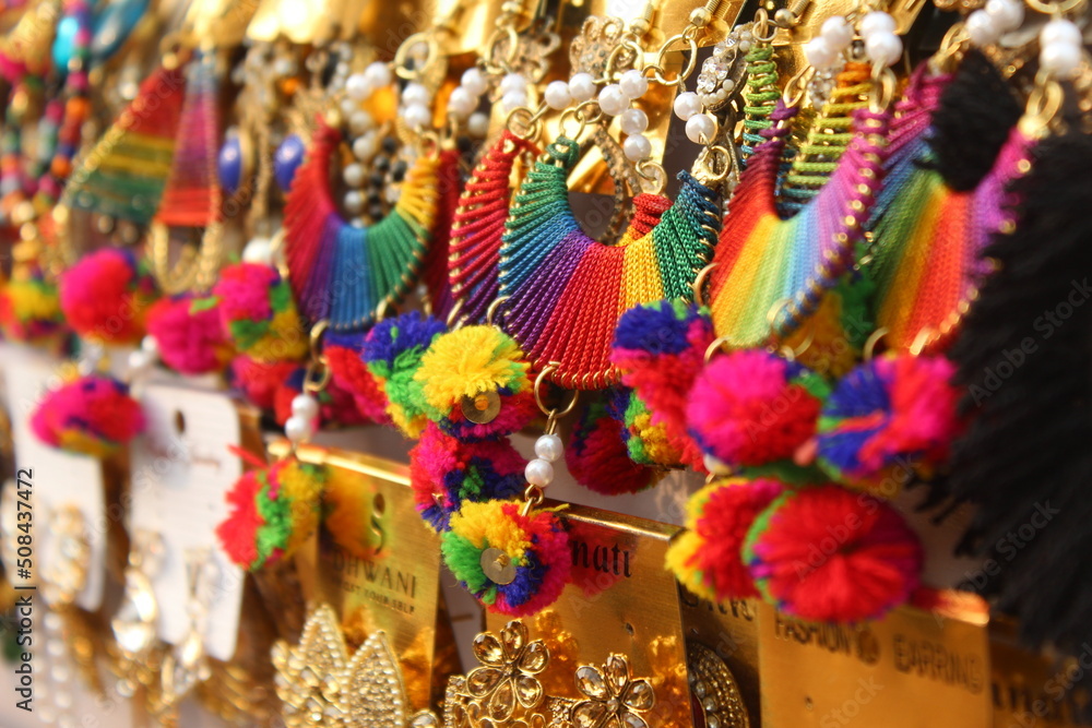 Colorful Indian earrings in street market.