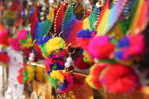 Colorful earrings in street market.