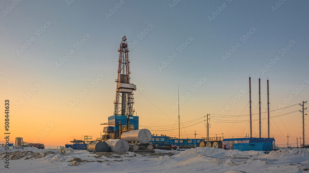 A general view of a drilling rig for drilling wells at an oil and gas field in the Arctic region. Winter. Day. Drilling equipment and technical infrastructure A general view of a drilling rig for drilling wells at an oil and gas field in the Arctic region. Winter. Day. Drilling equipment and technical infrastructure