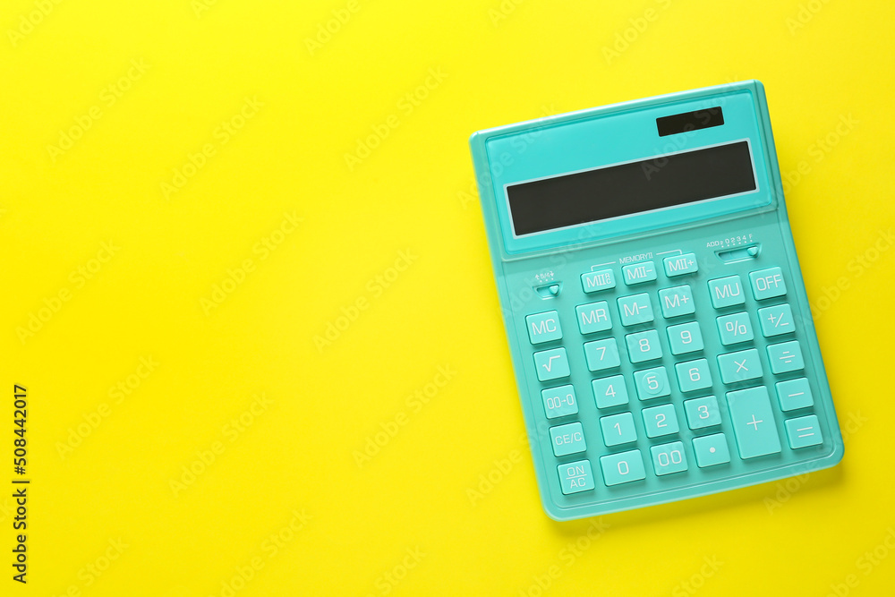 Modern calculator on yellow background, top view. Space for text Modern calculator on yellow background, top view. Space for text
