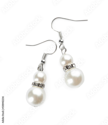 Elegant pearl earrings on white background, top view