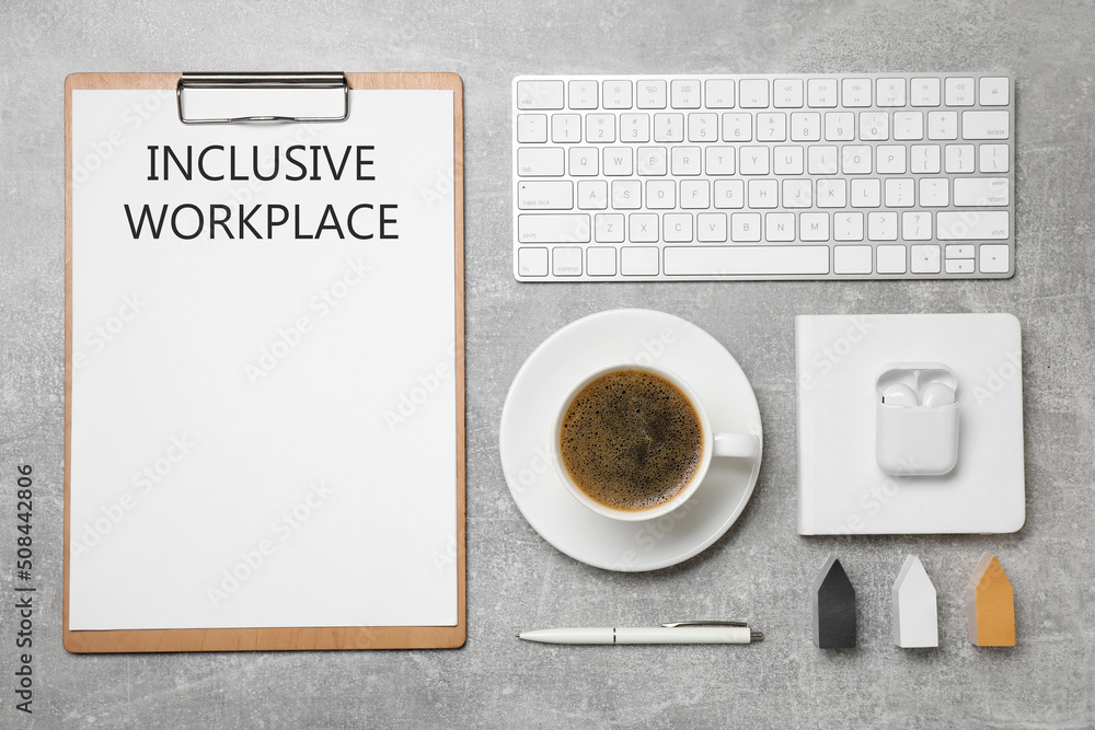 Inclusive workplace. Flat lay composition with clipboard, coffee and keyboard on grey table