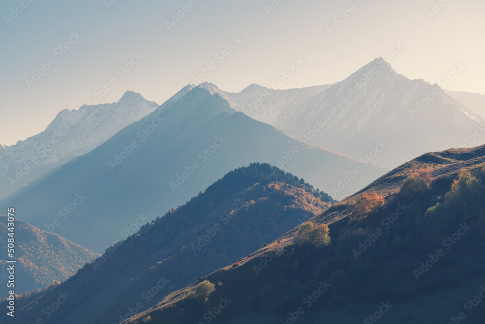 Beautiful mountains at sunset. Autumn landscape, abstract nature background. Ingushetia, North Caucasus, Russia.