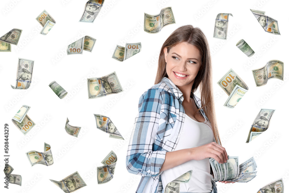 Happy young woman with money and falling American dollars on white background Happy young woman with money and falling American dollars on white background