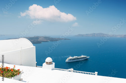 White architecture on Santorini island, Greece. Blue sea and the sky with white cloud. Travel and summer vacations concept