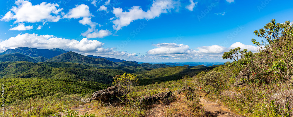 Panoramic image of the mountain ranges with their rocks and vegetation and typical forests of the state of Minas Gerais in Brazil on a sunny day