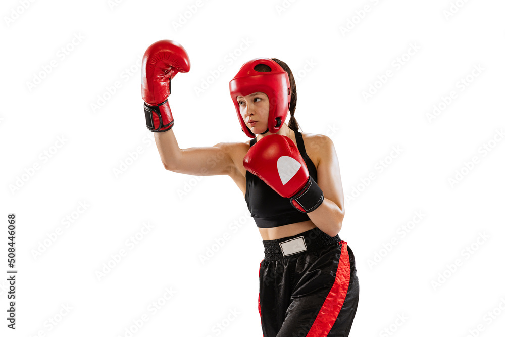 Professional female boxer in boxing gloves and helmet training isolated on white studio background. Sport, competition, hobby, results, success concept Professional female boxer in boxing gloves and helmet training isolated on white studio background. Sport, competition, hobby, results, success concept