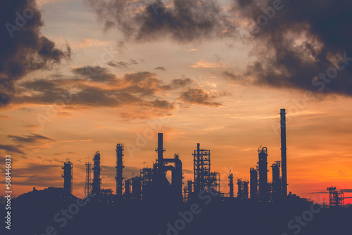 Oil​ refinery​ and​ plant and tower column of Petrochemistry industry in pipeline oil​ and​ gas​ ​industrial with​ cloud​ slowing red sky