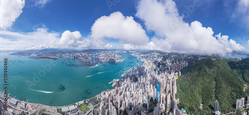 Canvas Print Epic aerial view of the Victoria Harbour in a clear day, with thick cloud and su