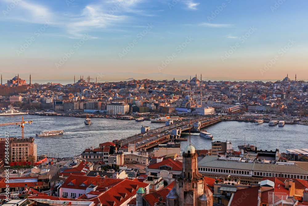 Fototapeta premium Istanbul skyline at sunset, Turkey. Panoramic view of Golden Horn and old districts of Istanbul from Galata tower.