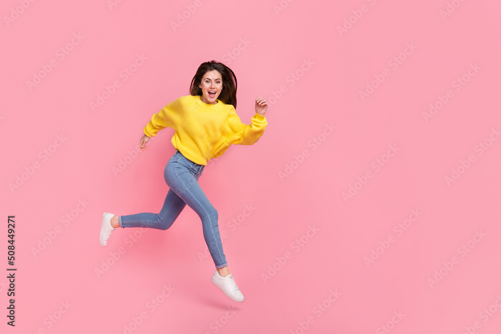 Full body profile side photo of young cheerful girl rush motion jump isolated over pink color background