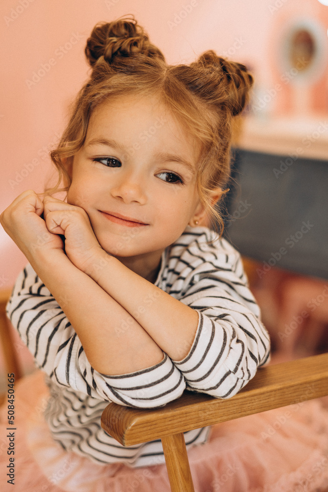 Portrait of a little beautiful girl with a stylish hairstyle in a beauty salon Portrait of a little beautiful girl with a stylish hairstyle in a beauty salon