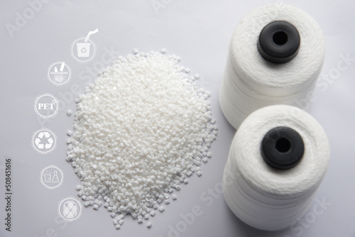 White Pet Chips Semi Dull,PET chips recycle,PET polyester chips and Raw White Polyester FDY Yarn spool with white background. Recycle icon, sustainable icon and Bottle icon.Chemical concept.