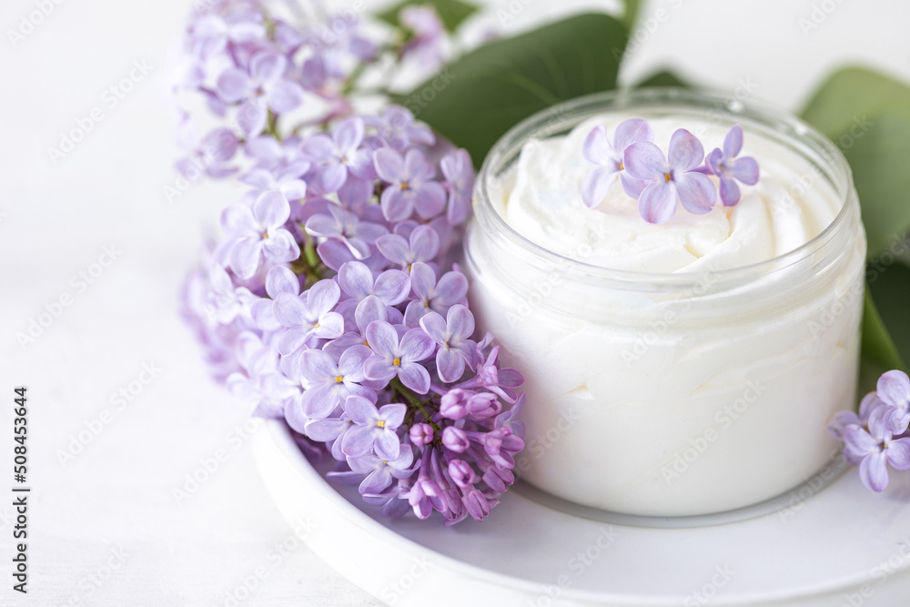 Concept of pure natural organic plant-based ingredients in cosmetology, herbal and flower extract. Lilac for anti-age and anti-acne therapy, gentle face and body skin care