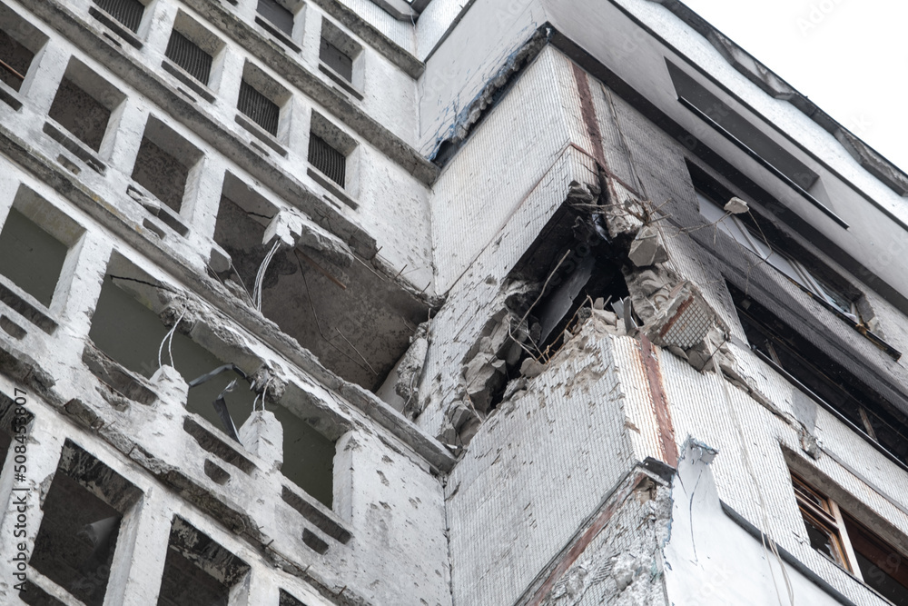 War in Ukraine 2022. Destroyed, bombed and burned residential building after Russian missiles in Kharkiv Ukraine. Selective focus. Russian attack on Ukraine. Russia is bombing Ukraine