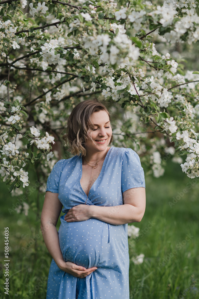 Middle-aged beautiful pregnant woman dreaming about child outdoors. Happy expectant thinking about baby and enjoying her future life. Motherhood, pregnancy, happiness, health care concept, copy space. Middle-aged beautiful pregnant woman dreaming about child outdoors. Happy expectant thinking about baby and enjoying her future life. Motherhood, pregnancy, happiness, health care concept, copy space.