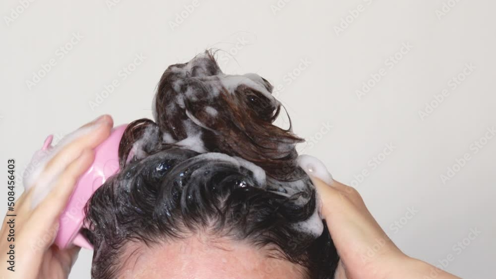 4k video hair growth stimulating, scalp massage.woman using pink scalp massager shampoo brush with silicone,flexible bristels.hair care,head relaxation.shampoo foam on hair,hand,isolated 4k video hair growth stimulating, scalp massage.woman using pink scalp massager shampoo brush with silicone,flexible bristels.hair care,head relaxation.shampoo foam on hair,hand,isolated