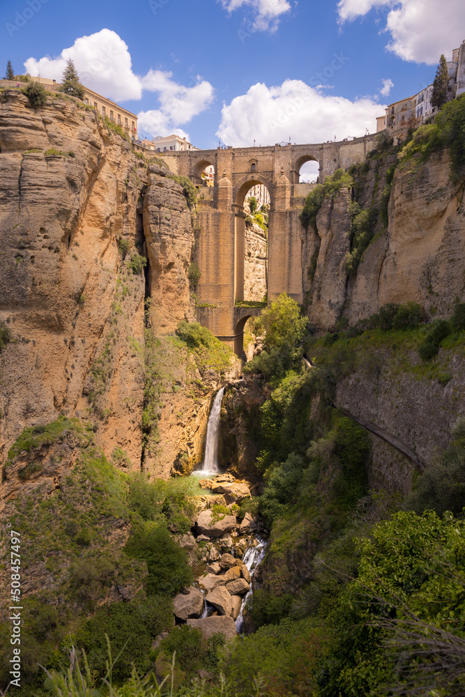 Scenic view of an old stone bridge over the canyon in Ronda, Spain at Puente Nuevo Bridge, Arch, Andalusia, Spain
