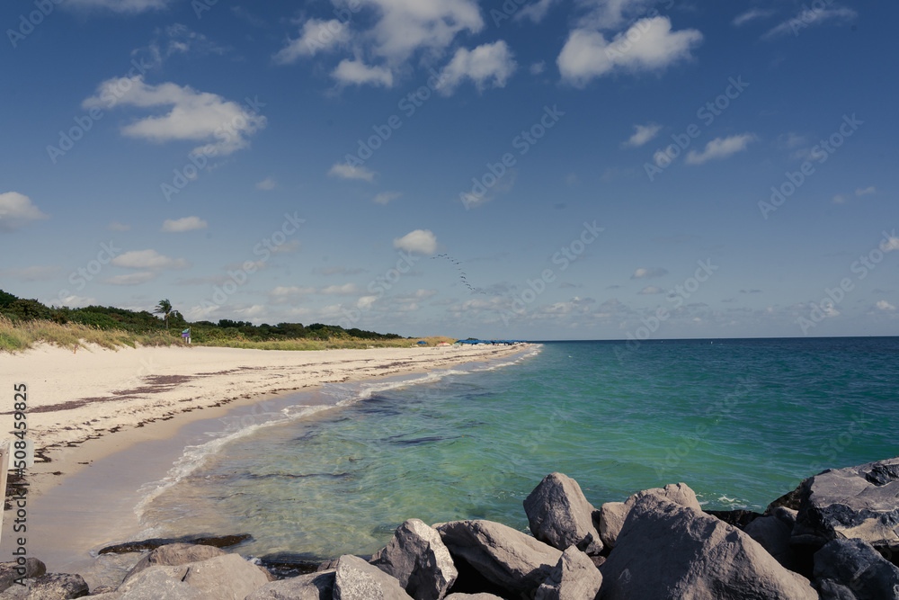 Beautiful beach view on a sunny summer day in Key Biscayne, Miami, Florida Beautiful beach view on a sunny summer day in Key Biscayne, Miami, Florida