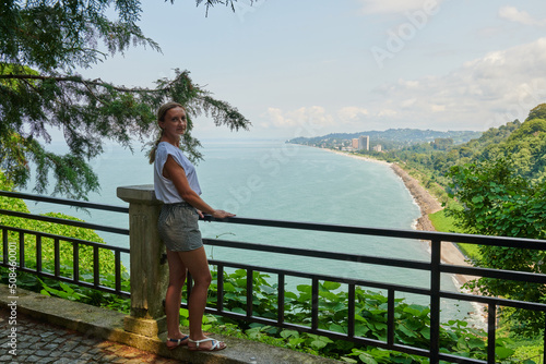 summer girl on the observation deck looks at the black sea in georgia