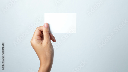 hand holding blank card
