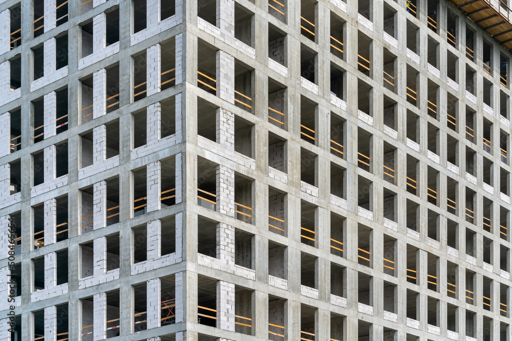 Facade of a house under construction. Мodern building industry. Sale and rental of real estate. Facade of a house under construction. Мodern building industry. Sale and rental of real estate.