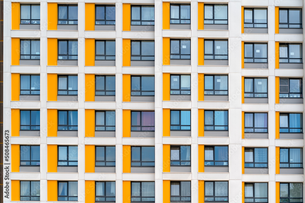 Windows of the facade of a modern building. Construction and rental housing. Windows of the facade of a modern building. Construction and rental housing.