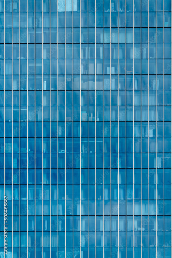Glass facade of a modern building. Construction and rental housing. Glass facade of a modern building. Construction and rental housing.