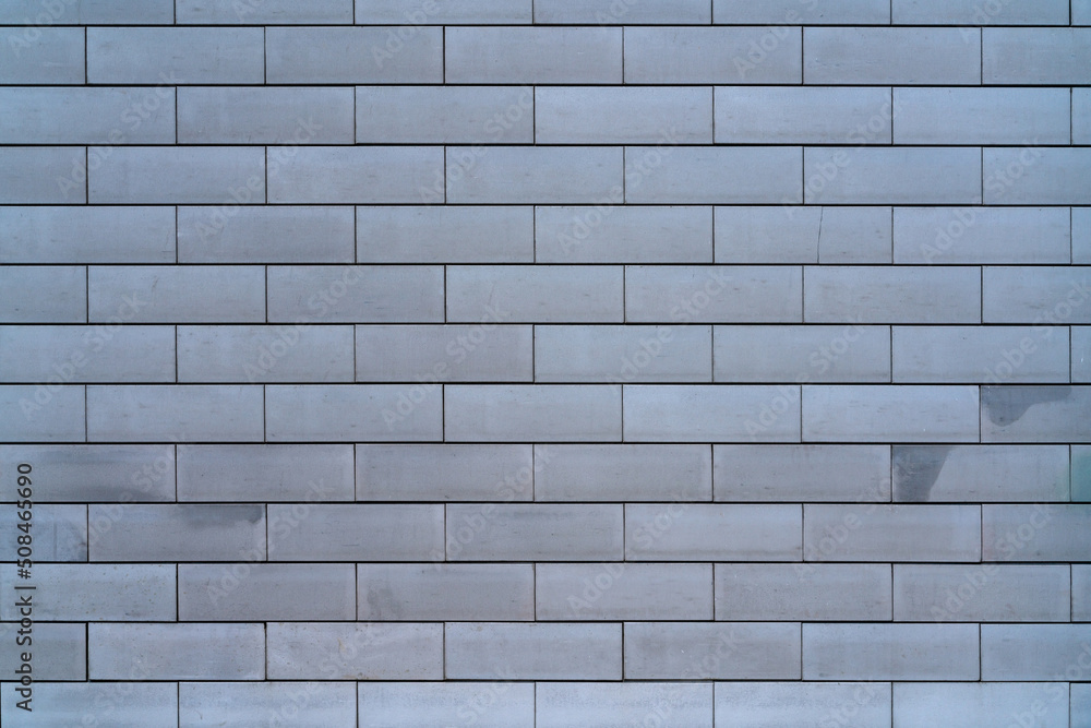 Naklejka premium Brick wall of the building. Designer building background.