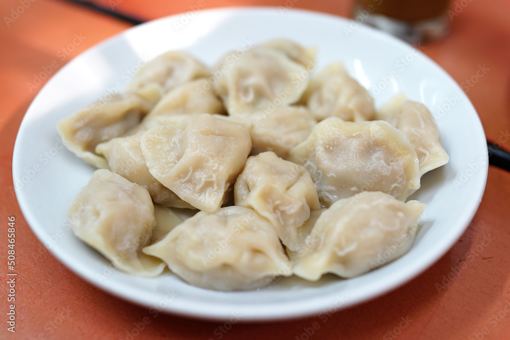 Close up a plate of traditional old Beijing dumplings. Close up a plate of traditional old Beijing dumplings.