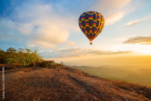 Fotografiet Colorful hot air balloons flying over mountain at Dot Inthanon in Chiang Mai, Thailand