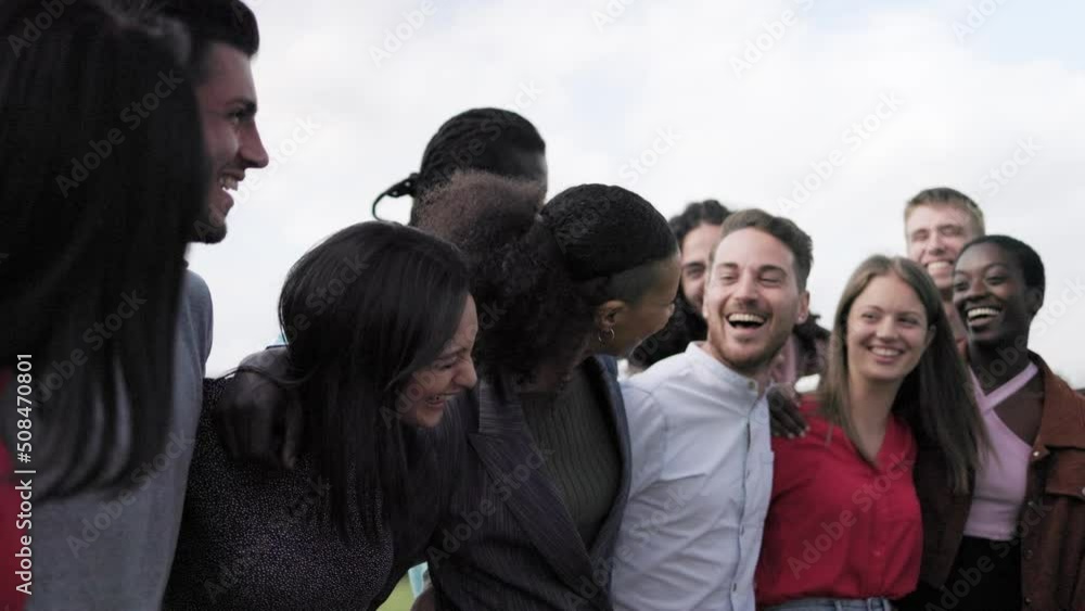 Multiethnic happy young group of friends having fun outdoor - Authentic people lifestyle concept