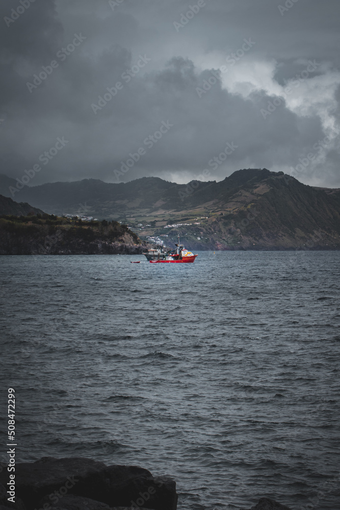 Boat in a moody storm, Azores
