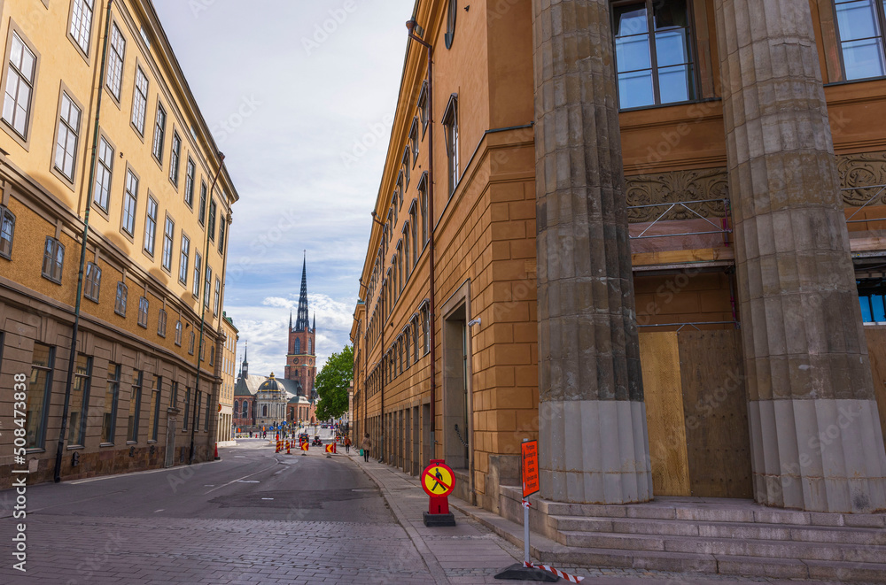 Beautiful view of tops old buildings and church on blue sky background. Sweden. Stockholm. 