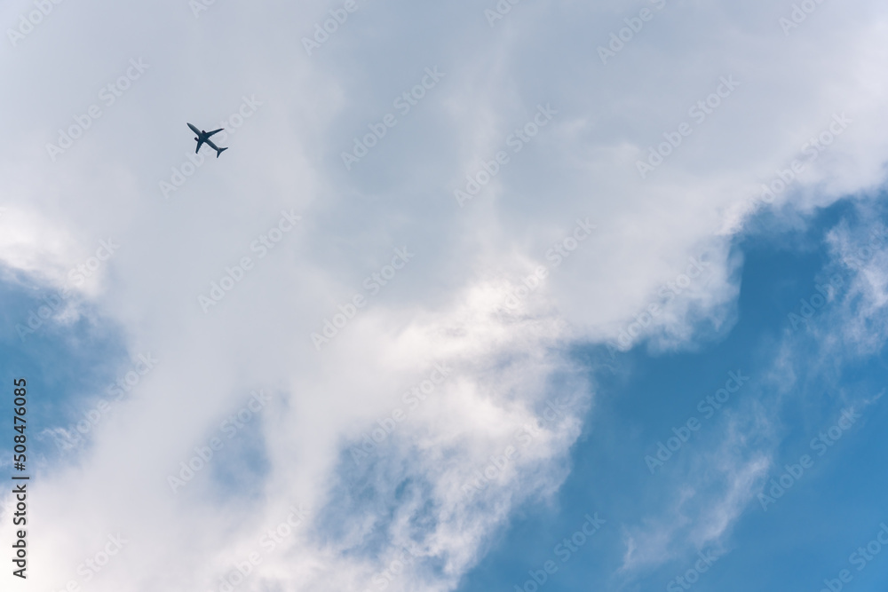Airplane flying in the sky with white clouds Airplane flying in the sky with white clouds
