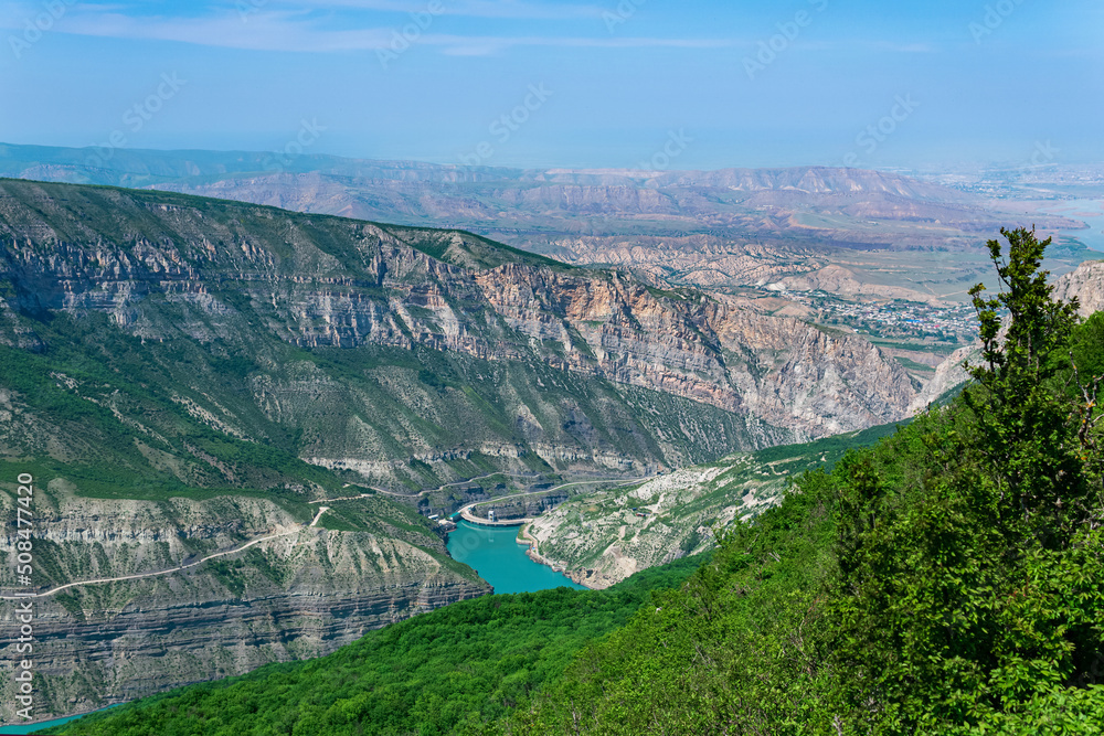 mountain landscape in the Caucasus with a view of the valley of the Sulak River, the Miatli hydroelectric power station and the towns of New Zubutli and Kizilyurt in the distance