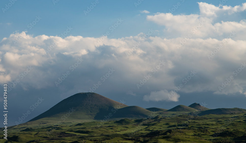 Beautiful mountains landscape. Mountains green hills, clouds on the blue sky