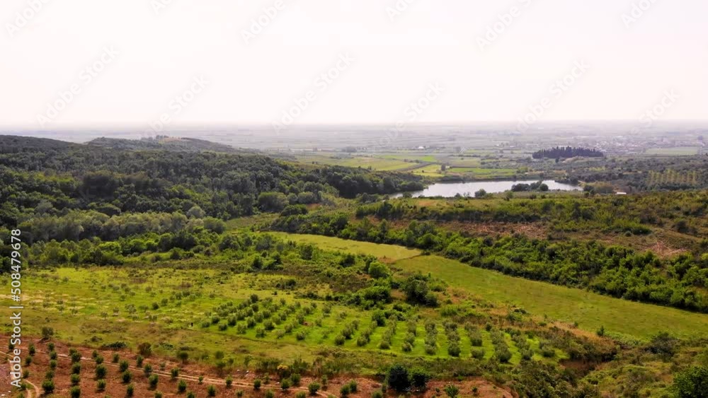 Aerial drone view over vineyards, towards agricultural fields, during sunset Aerial drone view over vineyards, towards agricultural fields, during sunset